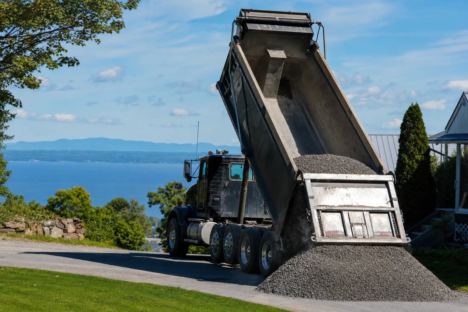 Dump truck delivering gravel